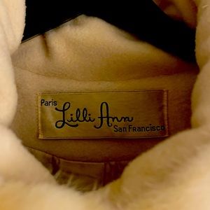 Vintage beige wool coat with fur trimming. One owner. Great condition.